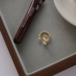 Classic 16K gold plated stainless steel open ring with asymmetrical branch and zircon