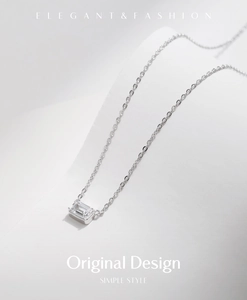 Detailed close-up of emerald-cut zircon pendant on a silver S925 chain necklace