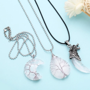 Detailed wire-wrapped life tree pendant on clear crystal moon and teardrop stones