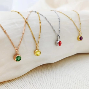 Elegant birthstone pendant necklaces with emerald, yellow, garnet and violet gems