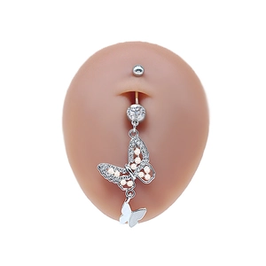 Detail of silver butterfly belly ring with pearls and zircon on silicone model