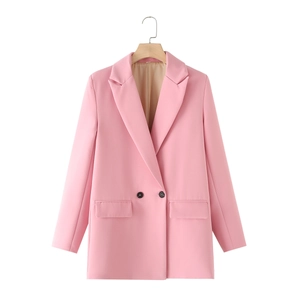 Detailed view of pink double-breasted blazer with classic notch lapel and black buttons