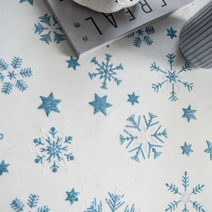 White Christmas tablecloth with blue glitter snowflakes and white embroidered edges