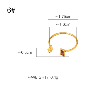 Abstract double-line gold plated titanium ring with amber and brown rectangle gemstones