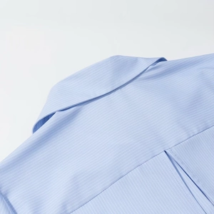 Front close-up of light blue striped long-sleeve shirt with lapel and precise stitching