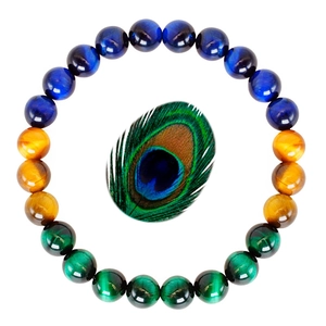 Detail of tiger eye and malachite beaded bracelet with an elegant peacock feather accent