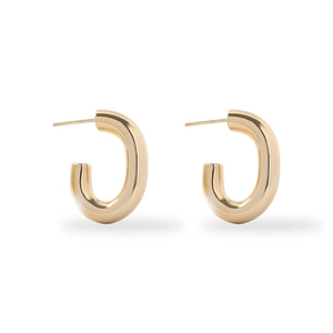 Detailed close-up of chunky C-shaped 18K gold plated stainless steel hoop earrings