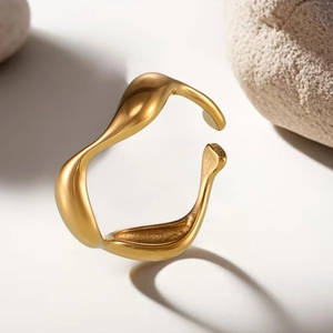 Minimalist gold plated stainless steel ring with elegant irregular wavy fluid design
