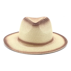Detailed weave pattern of two-tone gradient straw fedora hat with brown striped brim