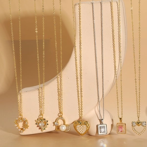 Collection of elegant heart pearl and zircon pendant necklaces in gold and silver finishes