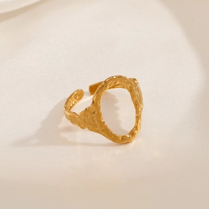 Gold adjustable stainless steel ring with hammered texture and oval cutout design