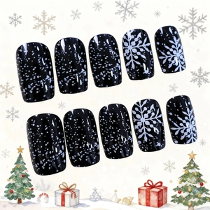 Christmas press-on nails set with black base and white snowflake patterns for holiday style