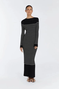Detail of slim fit knit maxi dress featuring black and white horizontal stripes texture
