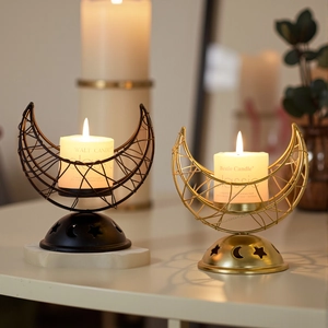 Black and gold crescent moon metal incense burners with aromatic pillar candles