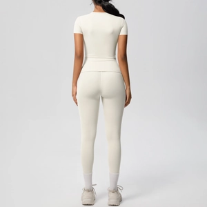 Back view of cream white slim fit yoga set showing seamless fabric texture and high waist fit