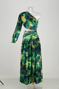 Detail of green and yellow abstract print maxi dress with waist cutout and gold chain link