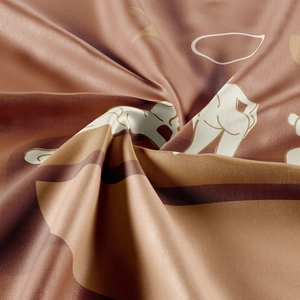 Detailed close-up showing the glossy satin texture and abstract pattern of the tapestry