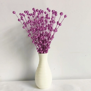 Detail of purple glitter berry branches in a white vase for festive home decoration