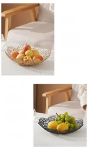 Detail of artistic iron wire fruit bowl with wavy edges and durable welding technique