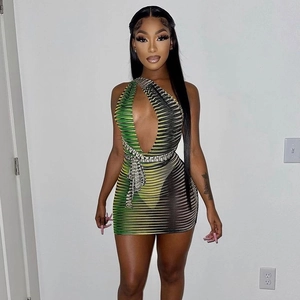 Detail view of green and black striped mini dress with cutout and side tie design