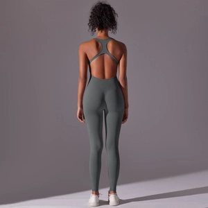 Detailed back view of a grey-green ribbed one-piece yoga jumpsuit with an open-back design
