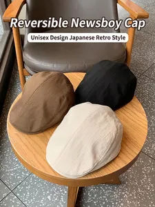 British vintage newsboy cap in black, brown, and cream with a textured fabric finish