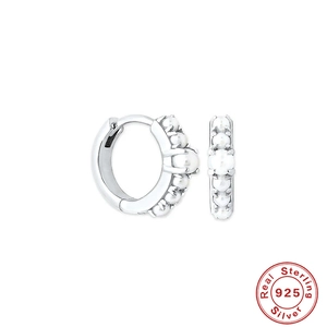 Classic S925 sterling silver hoop earrings featuring elegant white pearls on white background