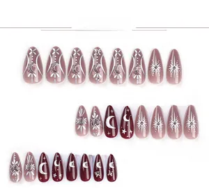 Macro view of 24pcs wine red press-on nails with silver star, moon and floral patterns