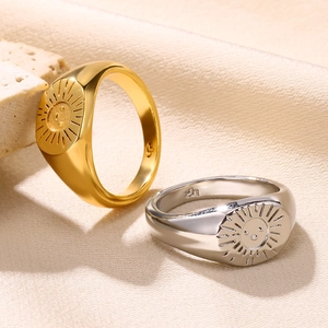 Vintage 18K gold and S925 silver sun smiley face signet rings on elegant stone props