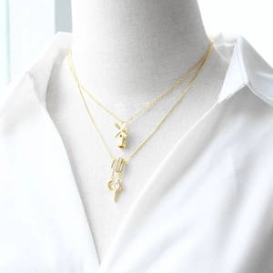 Layered 18k gold plated necklaces with windmill, moon and star pendants with zircons