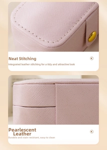 Detail of pink pearlescent leather jewelry box with neat stitching and seamless finish