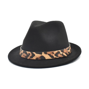 Classic black wool fedora hat with leopard print band and gold stud on white background