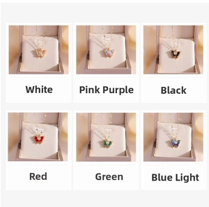 Detail view of butterfly pendants in six colors with gold plating and crystals