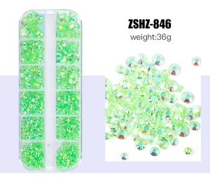 Detail view of 12-slot storage box with green resin rhinestones for nail art designs