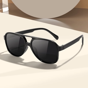Classic black double bridge pilot sunglasses with a minimalist geometric backdrop