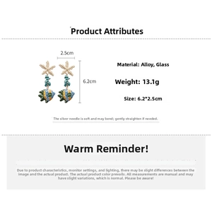 Detail view of starfish and fish glass earrings with 6.2cm length dimensions