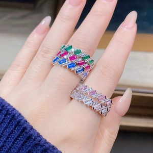 Close-up of S925 silver rings with rectangle-cut emerald, ruby, and sapphire stones