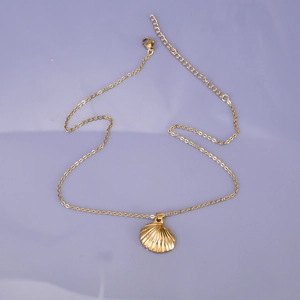 18K gold plated stainless steel necklace with seashell pendant on lavender background