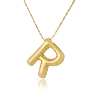 Detail macro view of the balloon-style letter P pendant with elegant golden metallic luster