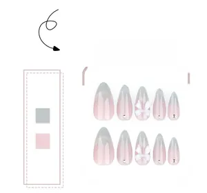Close-up of almond press-on nails with 3D bows and rhinestones in pink gradient