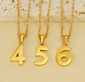 Detailed view of 18K gold stainless steel number pendants 4, 5, and 6 on chains