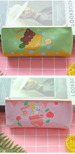Flat lay of cute PU leather bear and bunny pencil cases on a pink grid background