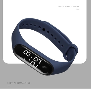 Waterproof LED digital watch with dark blue silicone strap and oval black touchscreen