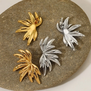 Gold and silver 316 stainless steel earrings in half-flower leaf design on natural stone