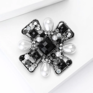 Detailed macro view of vintage Baroque brooch with pearls and crystals on metal base