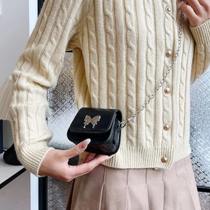Black mini saddle bag with silver butterfly clasp and metal chain strap for women
