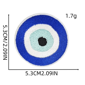 Close-up of 5.3cm blue evil eye embroidered patch showing dense stitching and fine details