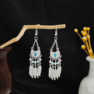 Bohemian silver long fringe earrings with blue gemstone and hanging metal feathers