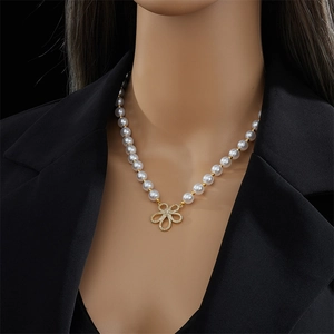 French style 18k gold plated flower pearl necklace worn on model neck for women