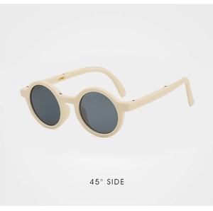 Detailed 45-degree side view of foldable beige round frames kids sunglasses